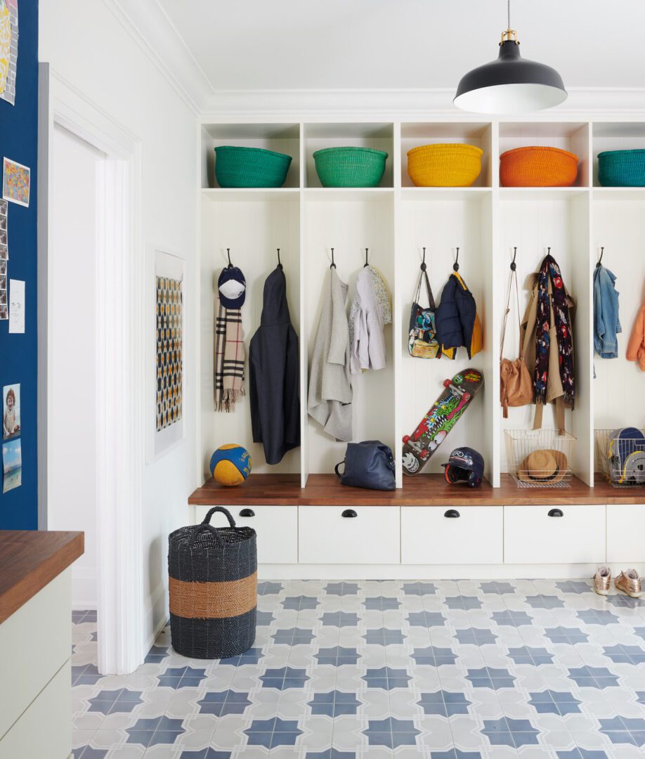 A room with many different colored shelves and hooks.