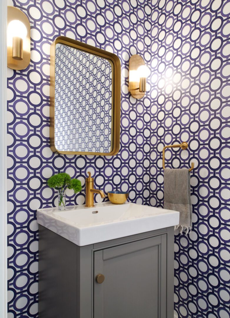 A bathroom with a sink and mirror in it